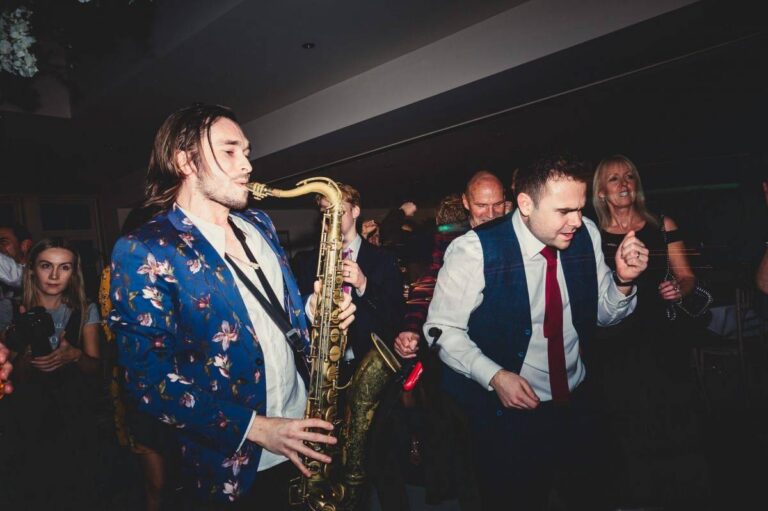 ben sax playing to busy dance floor