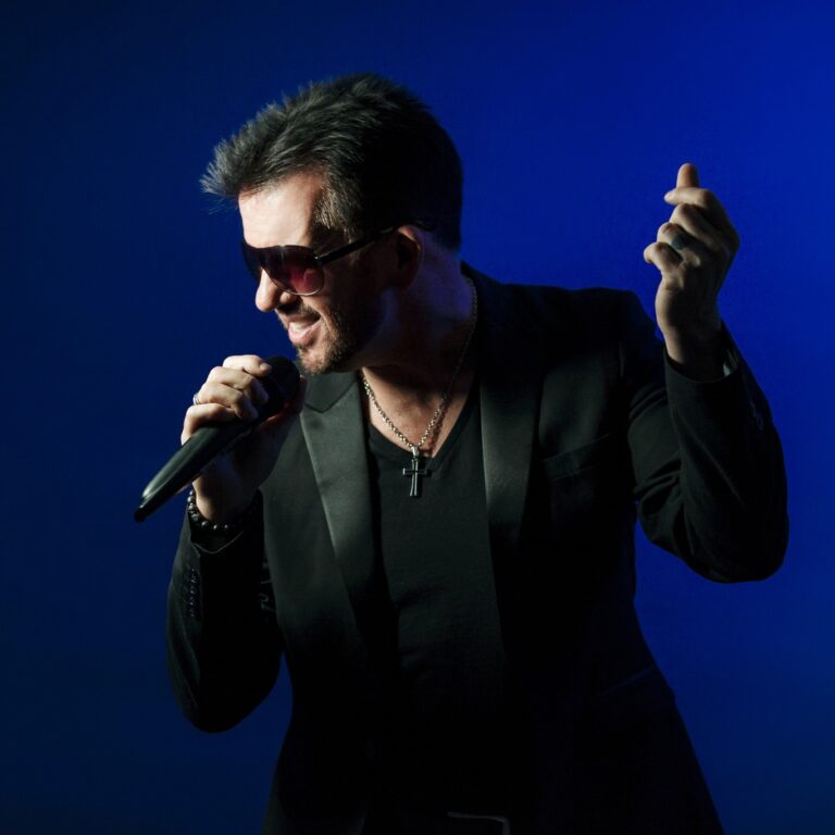 picture of George Michael tribute singing into microphone