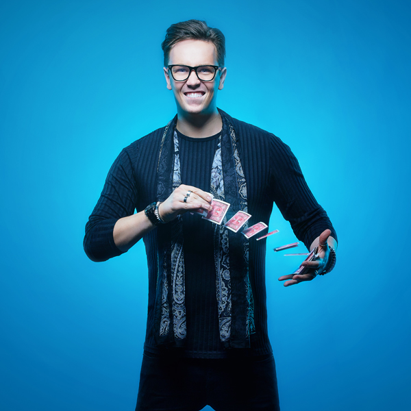 James p magician with blue background