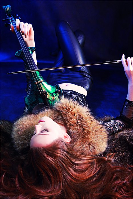 electric violinist lying on the floor