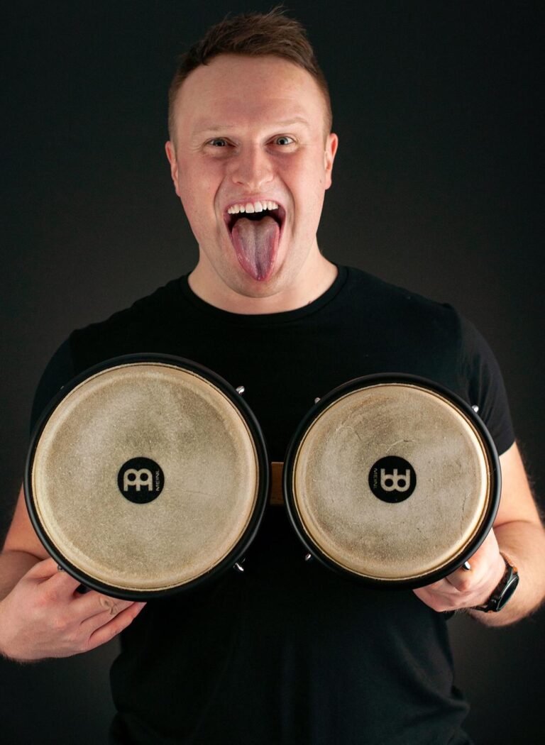 mike bongo holding bongos