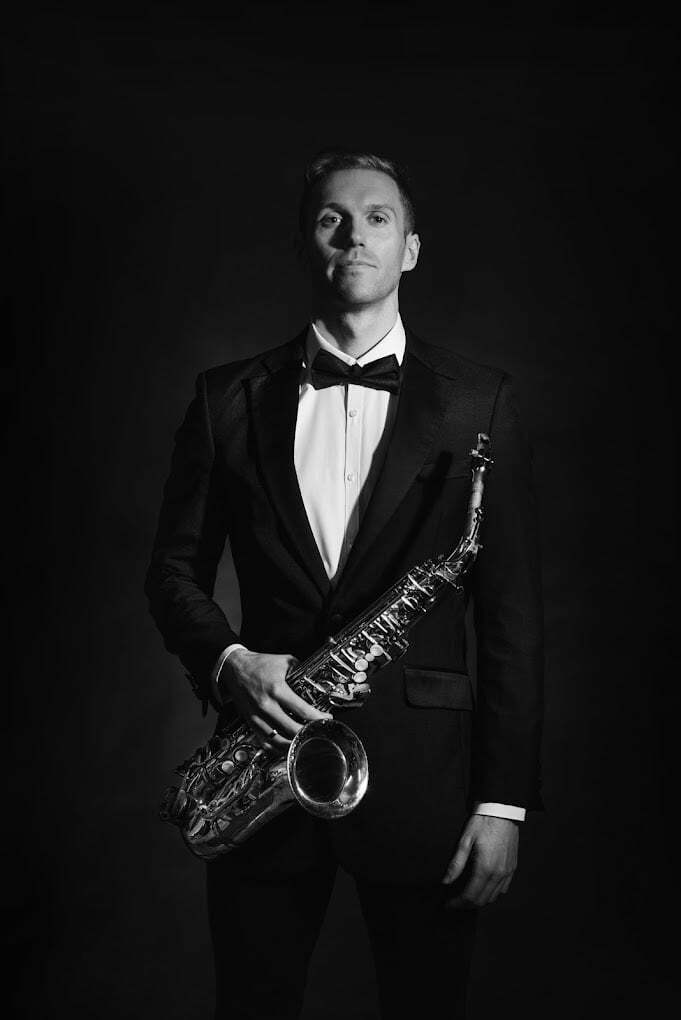 Ibiza Sax Wearing black tie and dinner suit holding sax