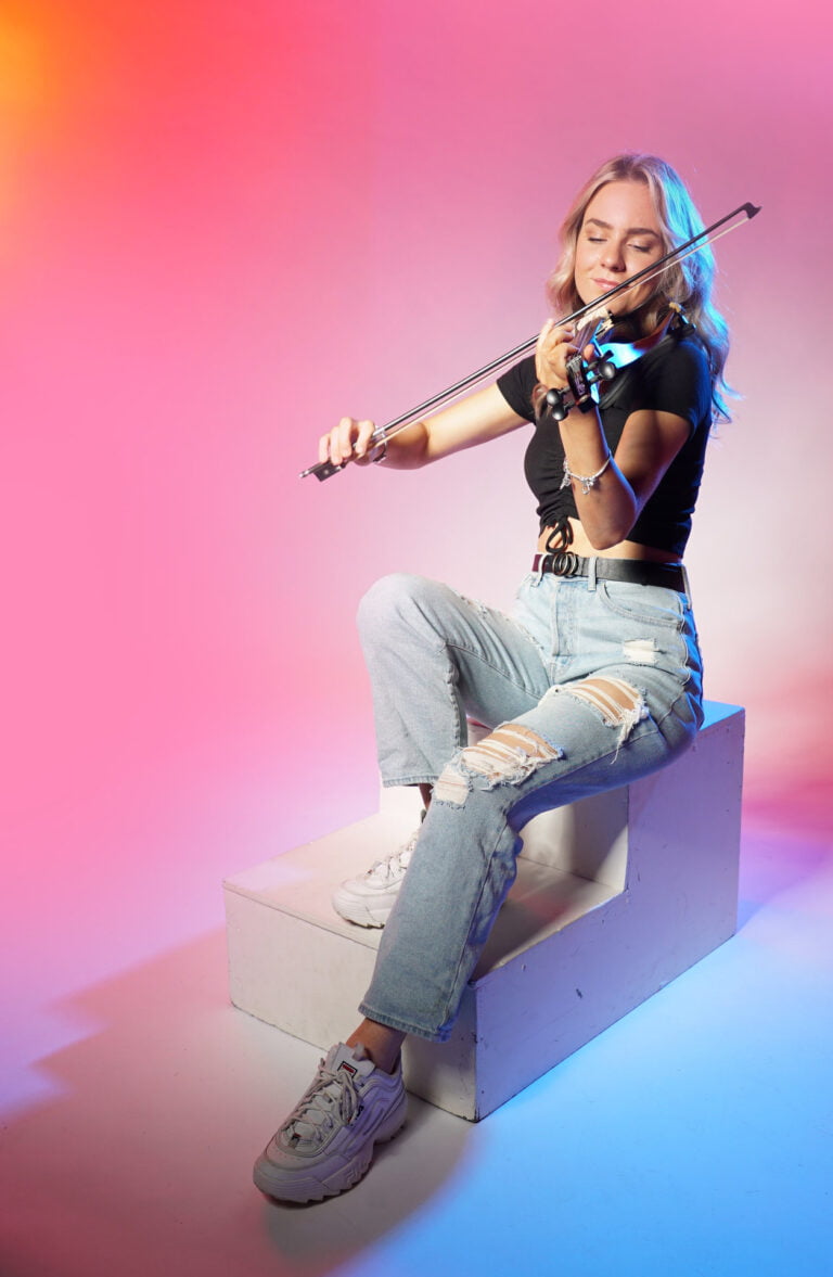 Miss Violin wearing a pair of blue jeans