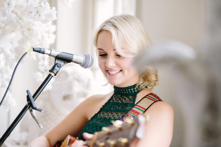 Daisy Acoustic Singer singing at a wedding