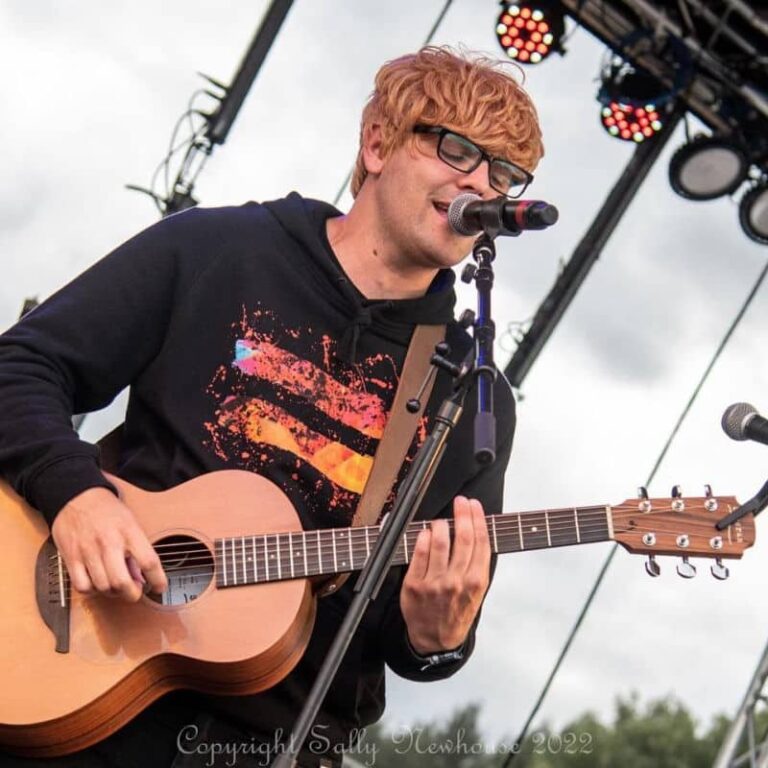 ed Sheeran tribute act on stage in the daytime