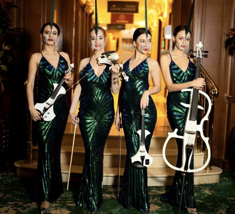 Euphoric Strings in green dress and white violins