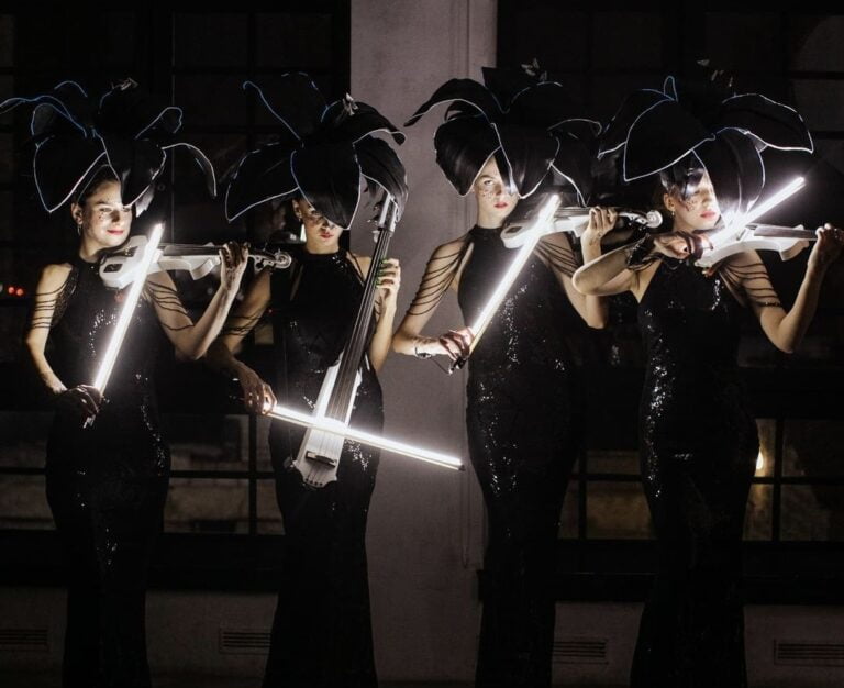 Euphoric Strings with led light up bows and white electric violins
