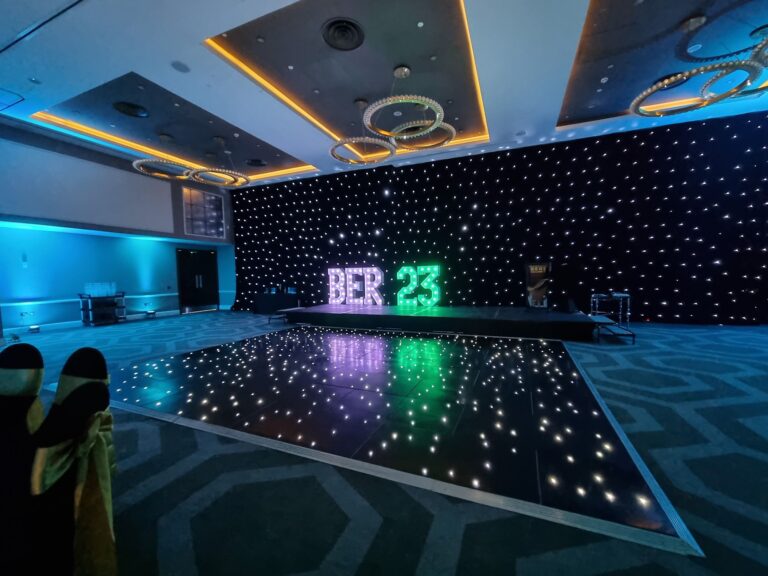 black dance floor set up at golf club