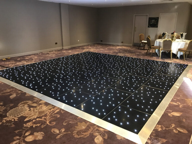 black dance floor set up at hotel function room