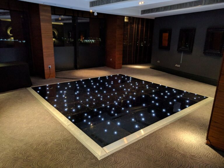 black dance floor set up in hotel