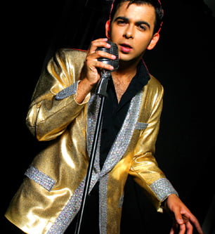 elvis presley tribute act in gold jacket