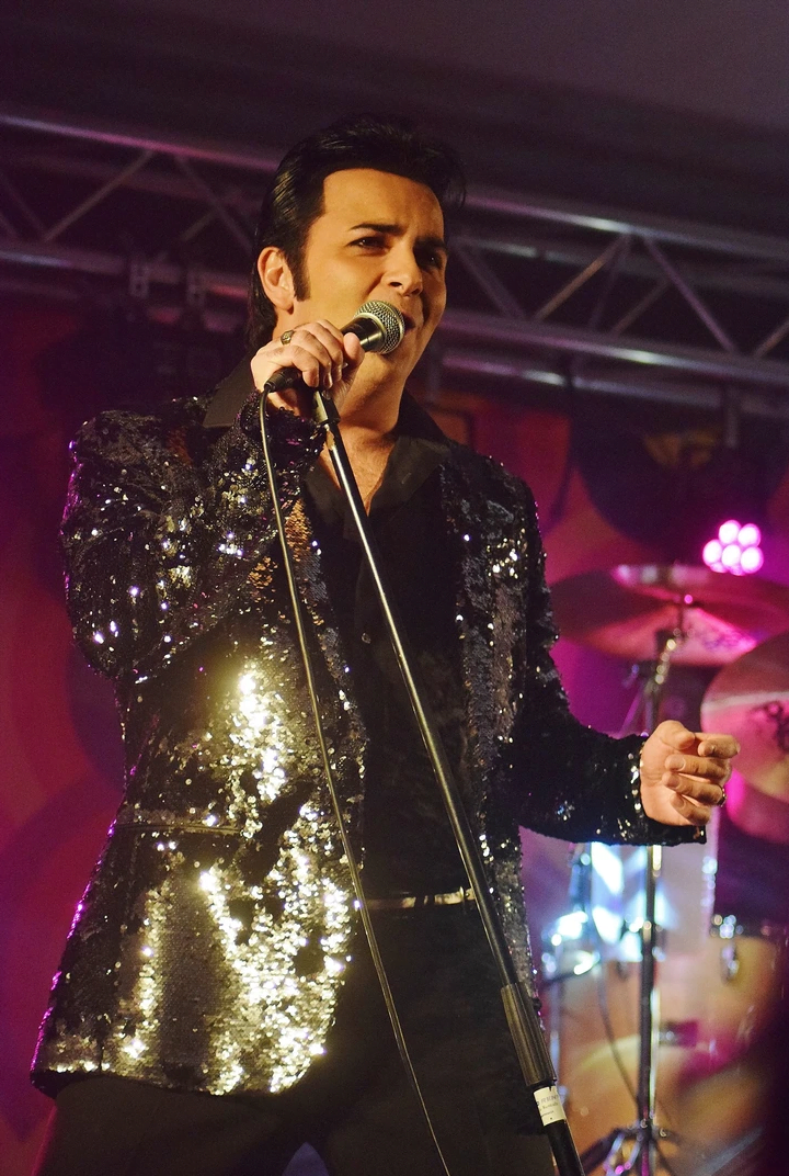 elvis presley tribute act in black sequin jacket