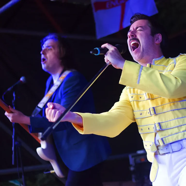 Picture of queen tribute band on stage