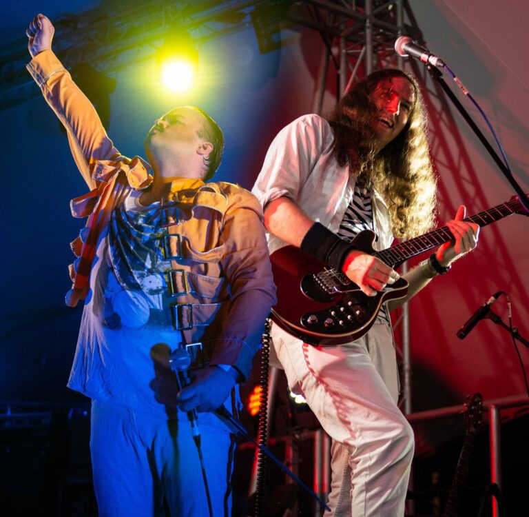 the queen show picture of Brian and Freddie