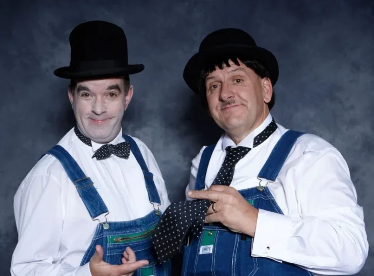 Laurel and Hardy Look-a-like act hiding tie