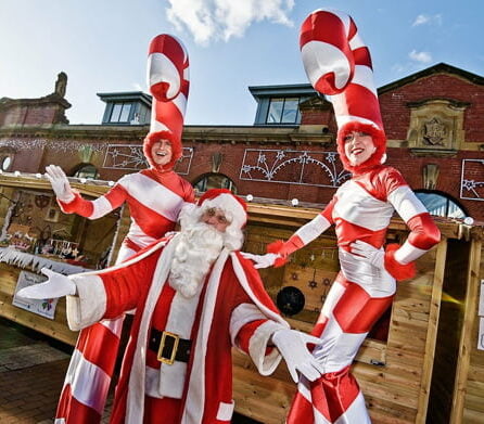 Christmas Stilt Walkers In Manchester