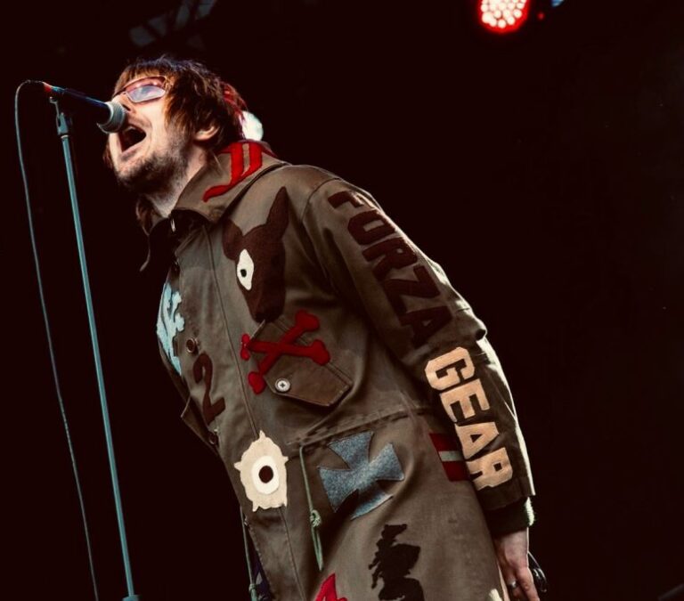 WonderNova - Oasis Tribute Band Singing Into Microphone