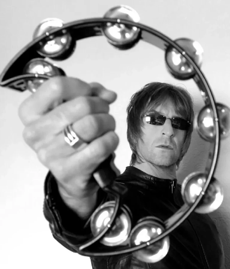 Absolutely Oasis - Oasis Tribute Band Holding Tamboruine